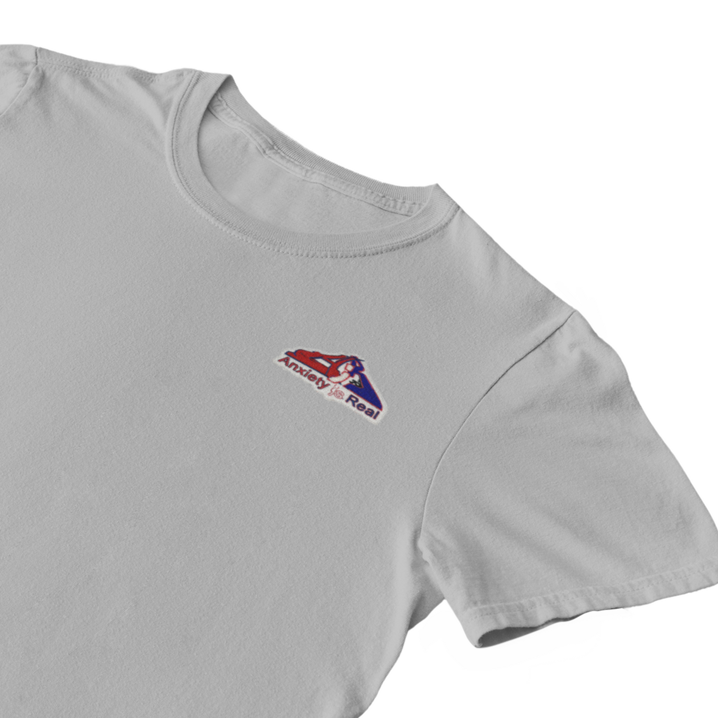 Gray cotton short sleeve tshirt with red, navy and white anxiety is real chenille patch on left chest area.