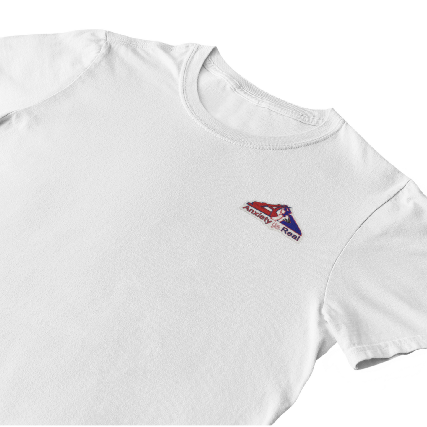 White cotton short sleeve tshirt with red, navy and white anxiety is real chenille patch on left chest area.