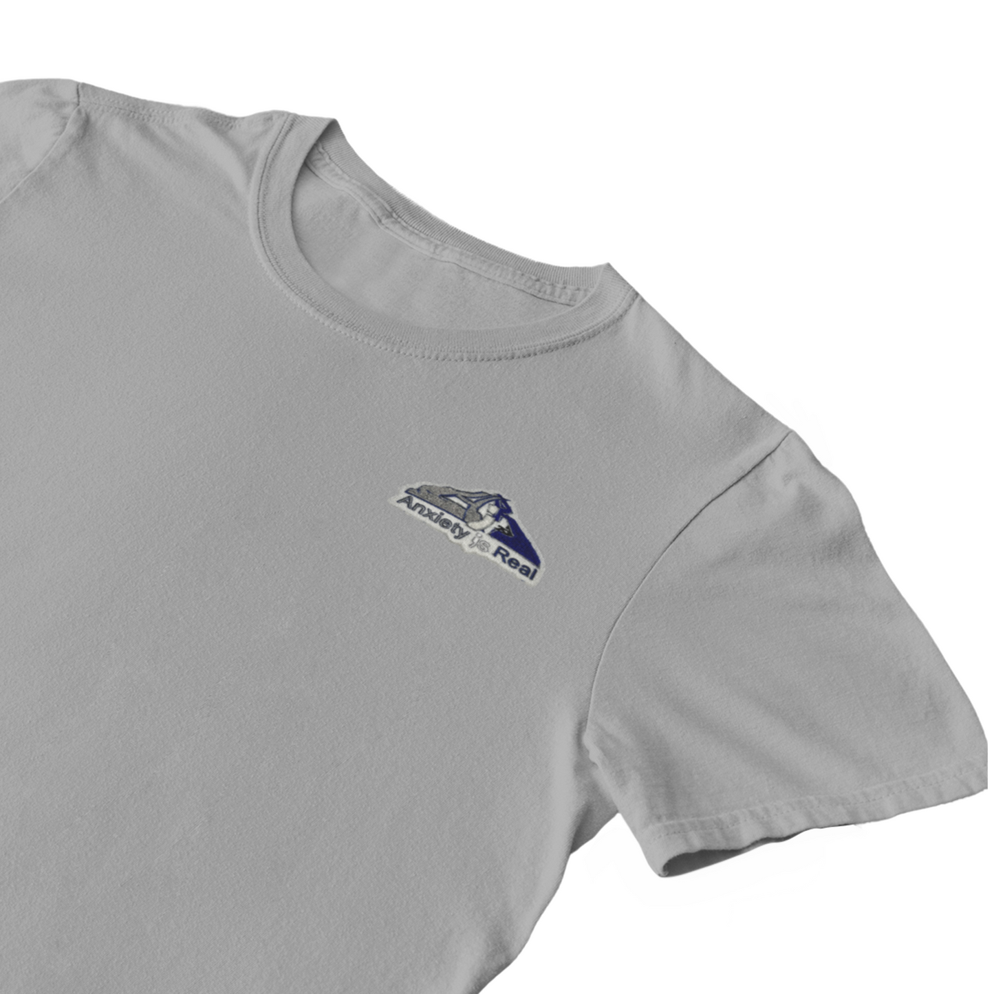 Gray cotton short sleeve tshirt with grey, navy and white anxiety is real chenille patch on left chest area.